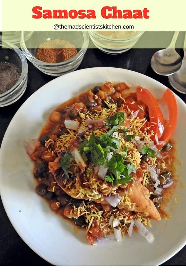 Samosa Chaat Samosa Chaat is mashed samosa topped with peas or chole masala and topped with tangy chutneys, sev, onion and tomatoes if you wish.