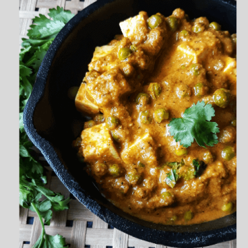 Mattar Paneer served in a bowl garnished with coriander