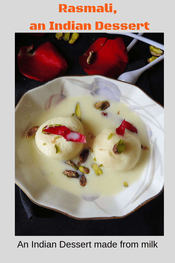 Rasmalai is served garnished with pistachio and rose petals
