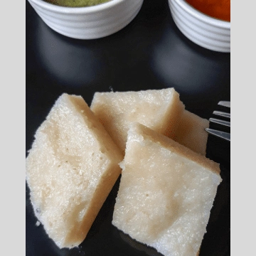 Simple beaten rice is steamed and served with chutney and sambhar