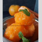 Granita from oranges and carrots served garnished with mint