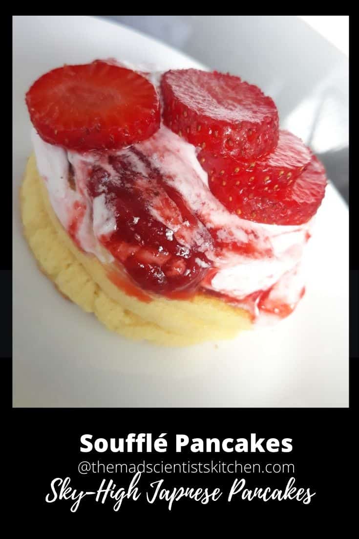 soufflé pancake topped with whipped cream, strawberry compote and strawberries
