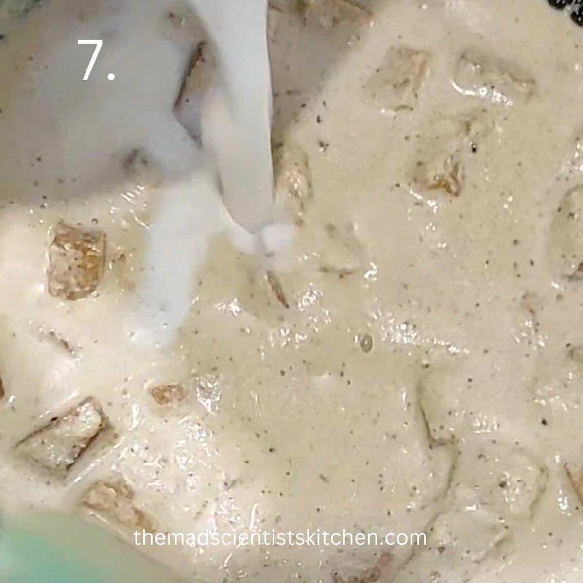 adding yogurt to the mix of yam and coconut paste.