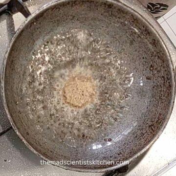 After mustard seeds add asafoetida in a tempering.