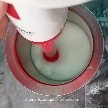 Whisking the Chaach to a smooth mixture